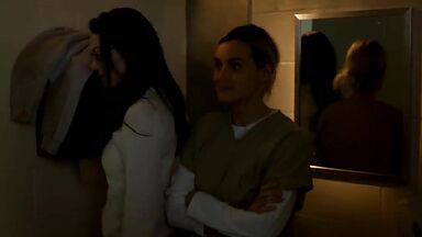 Taylor Schilling and  Laura Prepon as lesbians in Orange Is the New Black