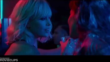 Charlize Theron and Sophia Boutella kissing