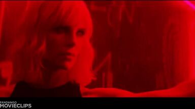 Charlize Theron and Sophia Boutella kissing