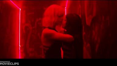 Charlize Theron and Sophia Boutella kissing