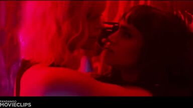 Charlize Theron and Sophia Boutella kissing