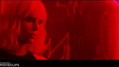 Charlize Theron and Sophia Boutella kissing