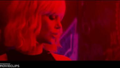 Charlize Theron and Sophia Boutella kissing