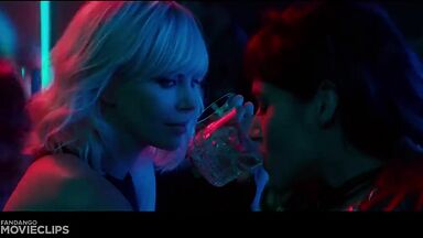 Charlize Theron and Sophia Boutella kissing