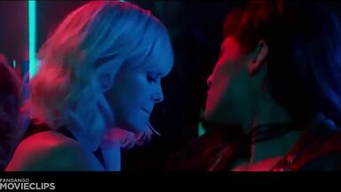 Charlize Theron and Sophia Boutella kissing