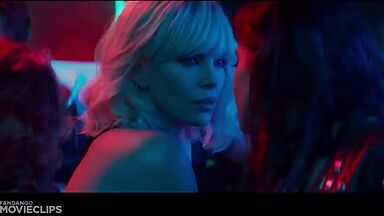 Charlize Theron and Sophia Boutella kissing