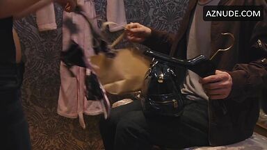 Jennifer Holland shows her breasts