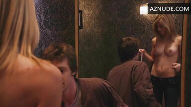 Jennifer Holland shows her breasts