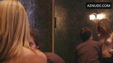 Jennifer Holland shows her breasts