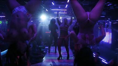 Strippers in dance club