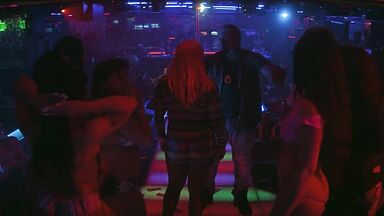 Strippers in dance club