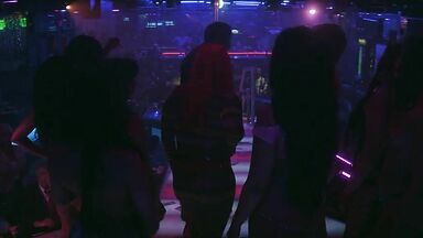 Strippers in dance club