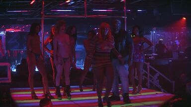 Strippers in dance club