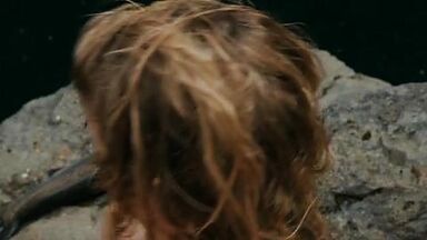 Hot blonde in the water