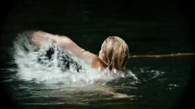 Hot blonde in the water