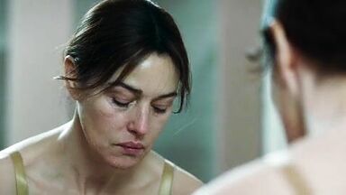 Monica undresses in a public bathroom