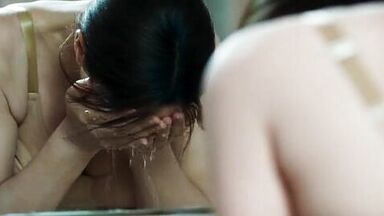 Monica undresses in a public bathroom