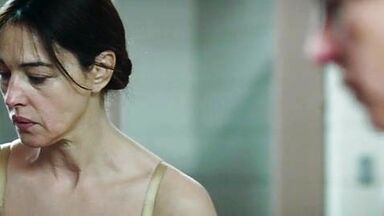 Monica undresses in a public bathroom