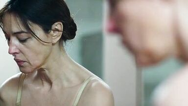 Monica undresses in a public bathroom