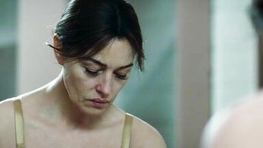 Monica undresses in a public bathroom