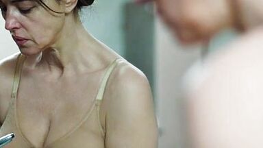 Monica undresses in a public bathroom