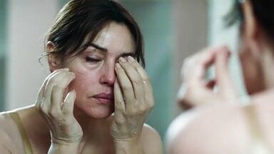 Monica undresses in a public bathroom