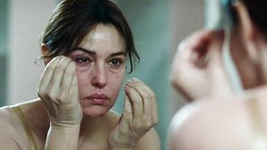 Monica undresses in a public bathroom