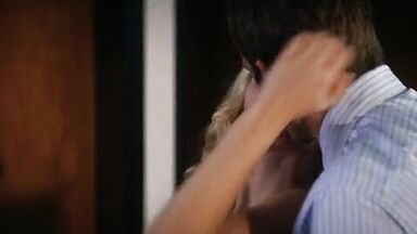 Passionate frenchkiss between Scarlett Johansson and Bradley Cooper