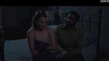 Wild kisses between Margot Robbie and a black man