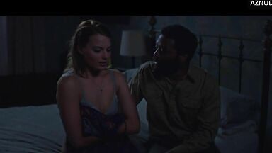 Wild kisses between Margot Robbie and a black man