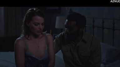 Wild kisses between Margot Robbie and a black man