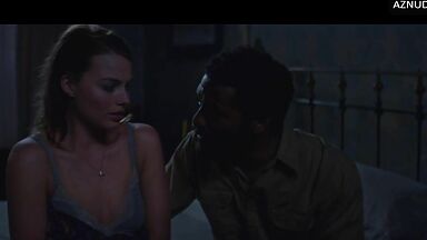 Wild kisses between Margot Robbie and a black man