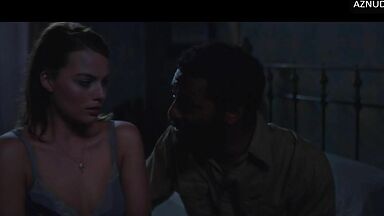 Wild kisses between Margot Robbie and a black man