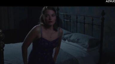 Wild kisses between Margot Robbie and a black man