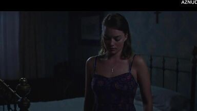 Wild kisses between Margot Robbie and a black man