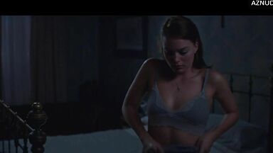 Wild kisses between Margot Robbie and a black man