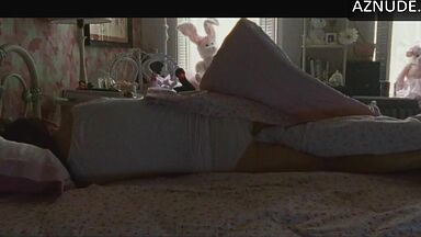 She masturbates in bed thinking she is alone in the room