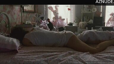 She masturbates in bed thinking she is alone in the room