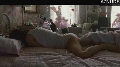 She masturbates in bed thinking she is alone in the room