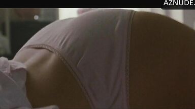 She masturbates in bed thinking she is alone in the room