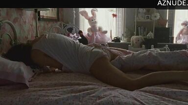 She masturbates in bed thinking she is alone in the room