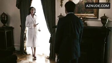 Anne Hathaway in bathrobe and underwear