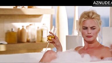 Blonde in a bathtub full of foam