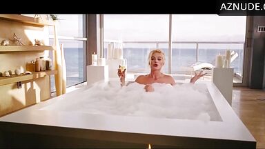 Blonde in a bathtub full of foam
