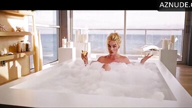 Blonde in a bathtub full of foam