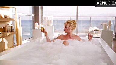 Blonde in a bathtub full of foam