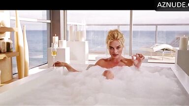 Blonde in a bathtub full of foam