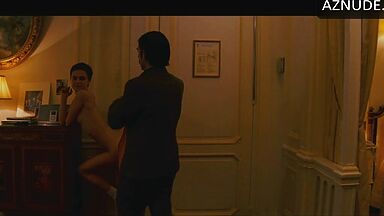 Anne Hathaway naked in a hotel room