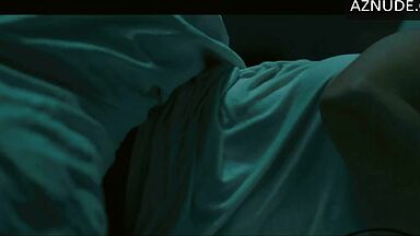 In underwear with the duvet on her