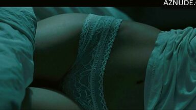 In underwear with the duvet on her